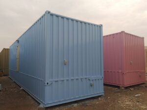 Light blue portable container cabin ready for transportation and field deployment.