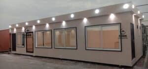 Long executive cement board porta cabin with modern outdoor lighting