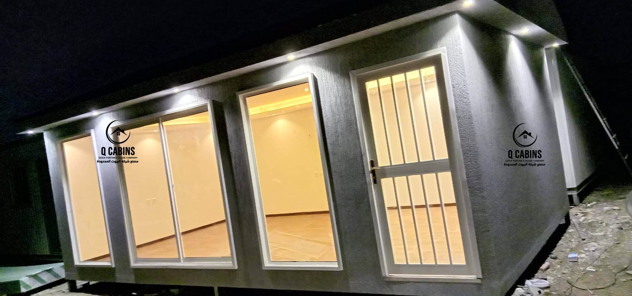 Night view of illuminated cement board porta cabin with secure entry door