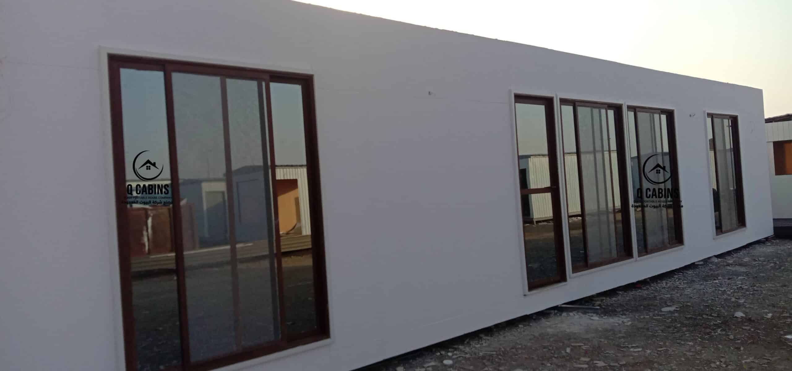 Cement board porta cabin featuring floor-to-ceiling window panels