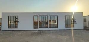 Front view of white insulated cement board prefabricated cabin unit
