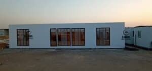 White insulated cement board porta cabin on site