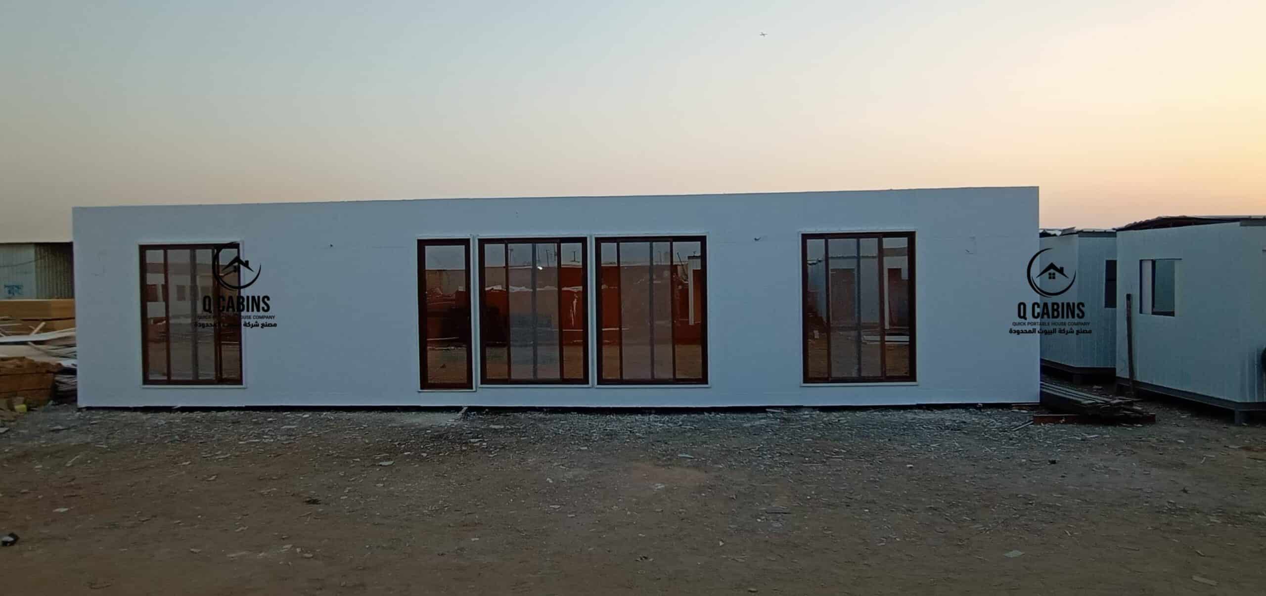 White insulated cement board porta cabin on site