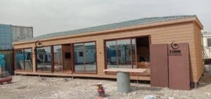 Spacious cement board modular cabin with continuous glass facade