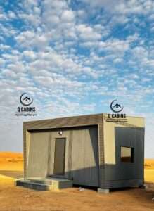 Modern compact prefabricated porta cabin with grey cladding and wood finish details