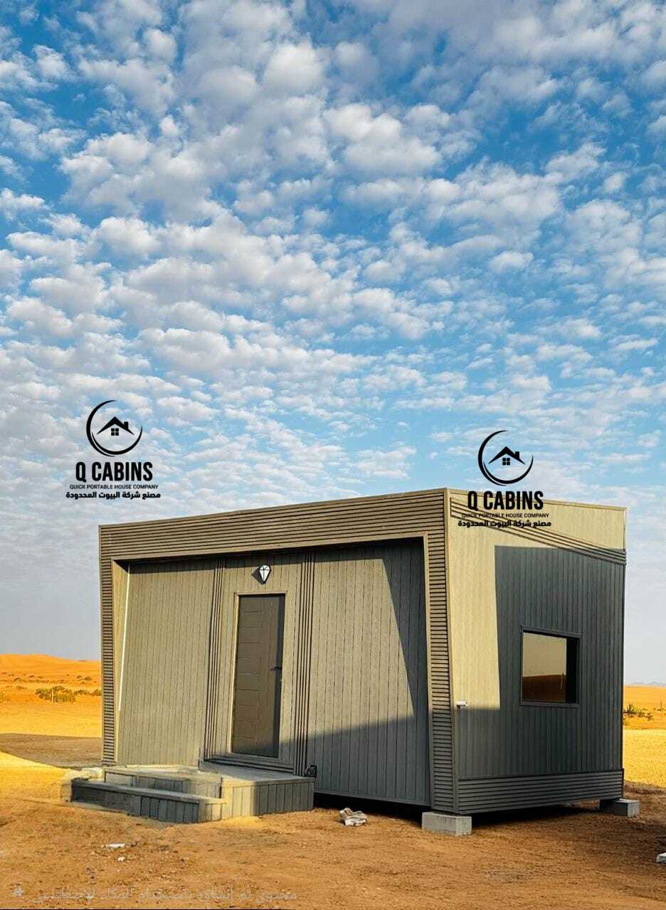 Modern compact prefabricated porta cabin with grey cladding and wood finish details