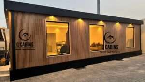 Close-up view of modern illuminated windows on a WPC wood plastic composite prefabricated room