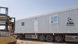 Transporting prefabricated shinko porta cabin on flatbed truck