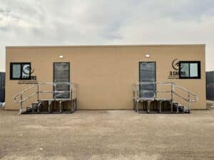 Front view of a double-door prefab cement board office cabin in Saudi Arabia.