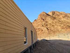 Exterior side view of WPC cladding modular site office cabin in Riyadh