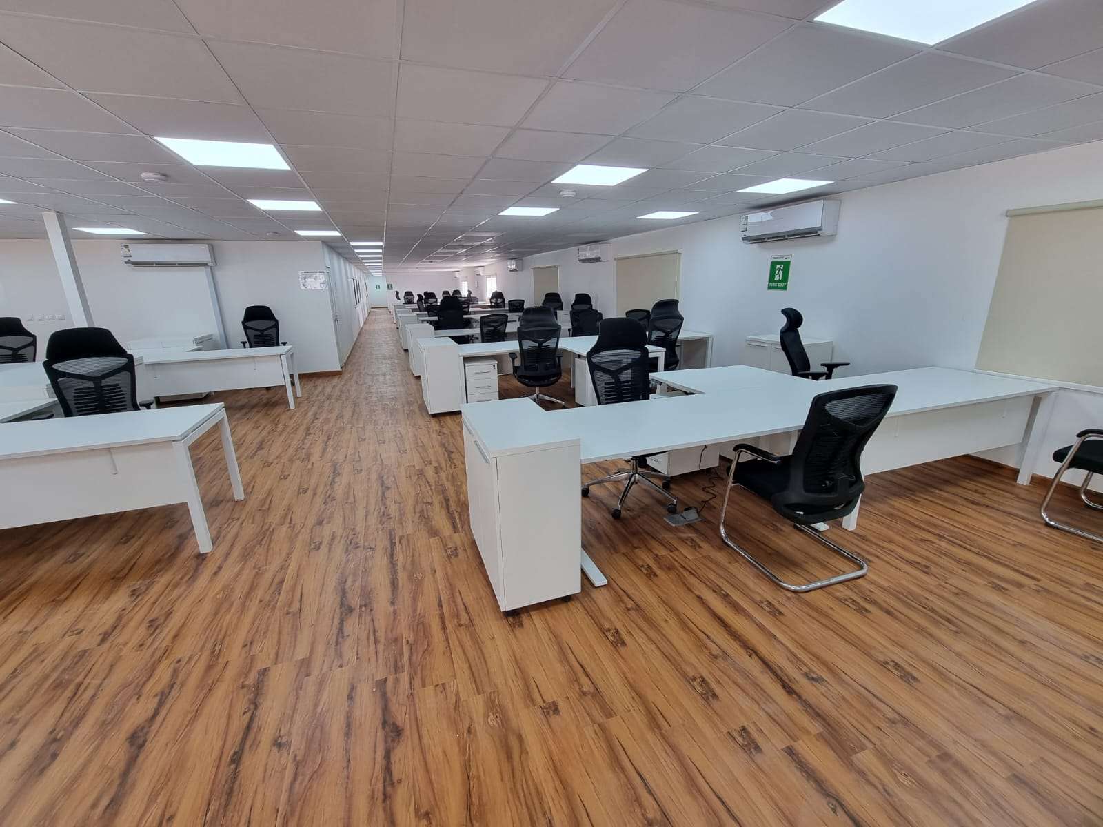 Spacious open-space interior of prefabricated site office for engineers and staff in Riyadh