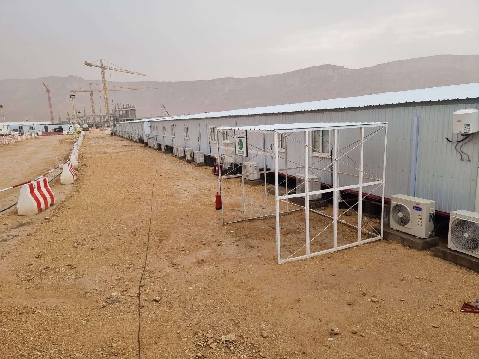 Site office walkways and temporary shaded structures for workers in Riyadh construction site