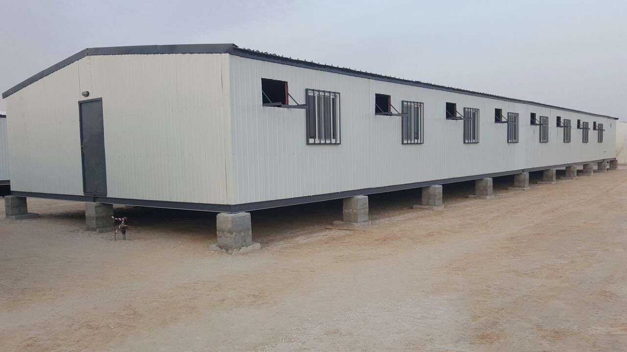 Prefab site office porta cabin on elevated concrete foundation for construction staff in Riyadh