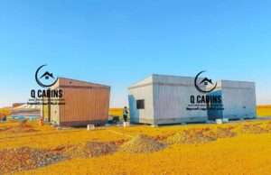 Small portable cabin prefabricated unit with modern grey cladding installed outdoors