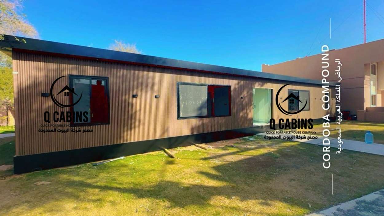 Portable prefab room featuring wood alternative cladding and large window setup
