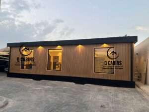 Modern prefabricated house with warm WPC wood plastic composite cladding and exterior lighting
