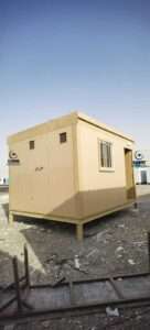 Beige prefabricated sandwich panel room on raised steel base