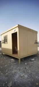 Small beige insulated sandwich panel cabin structure