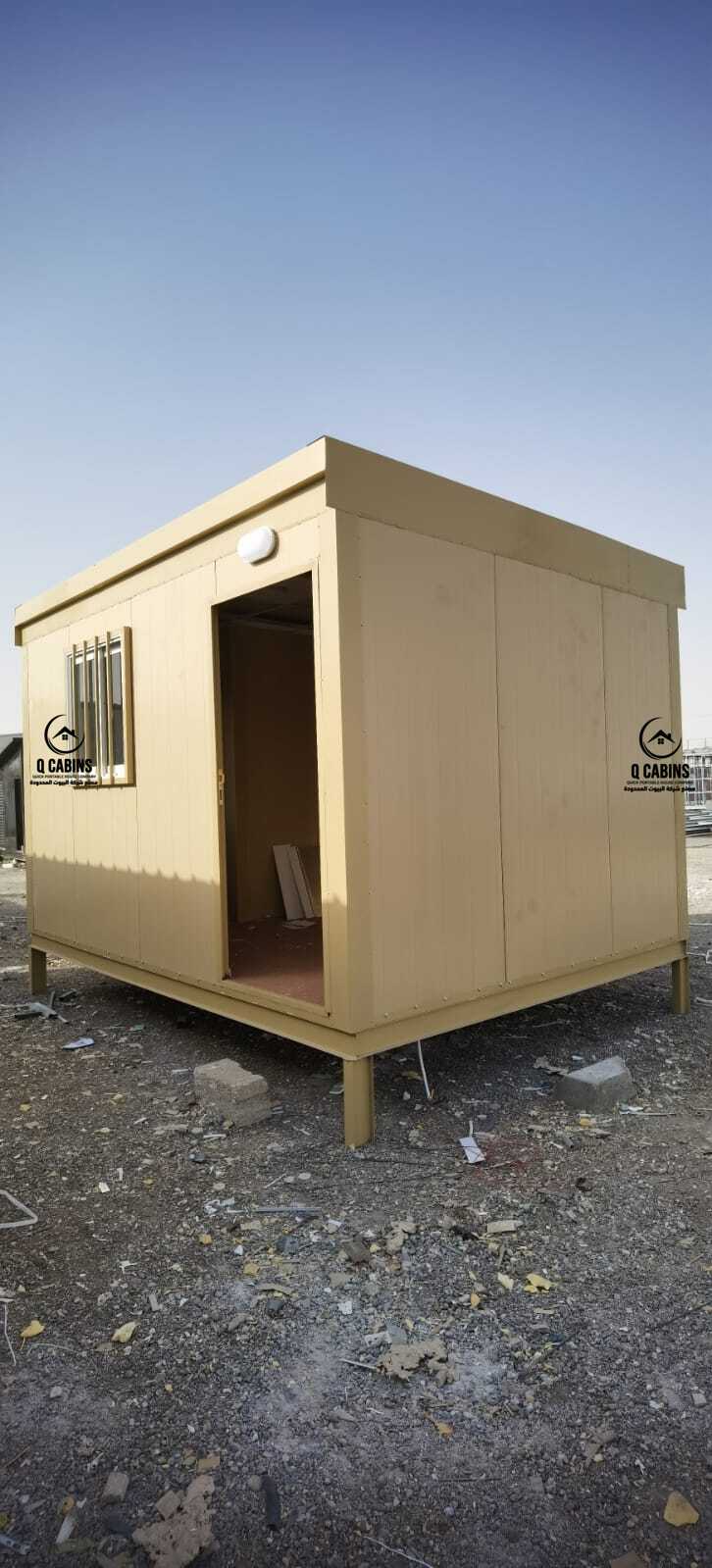 Small beige insulated sandwich panel cabin structure