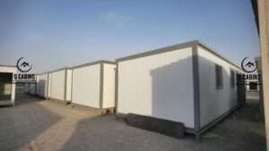 Line of white sandwich panel porta cabins prepared for delivery