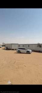 White insulated sandwich panel portable cabin unit setup outdoors