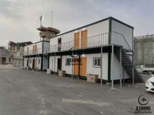 Large two-story sandwich panel accommodation complex with steel walkway and stairs