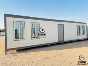 Long insulated sandwich panel portable office with multiple windows and access door