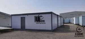 White sandwich panel portable room unit with dark border trim and aluminum windows