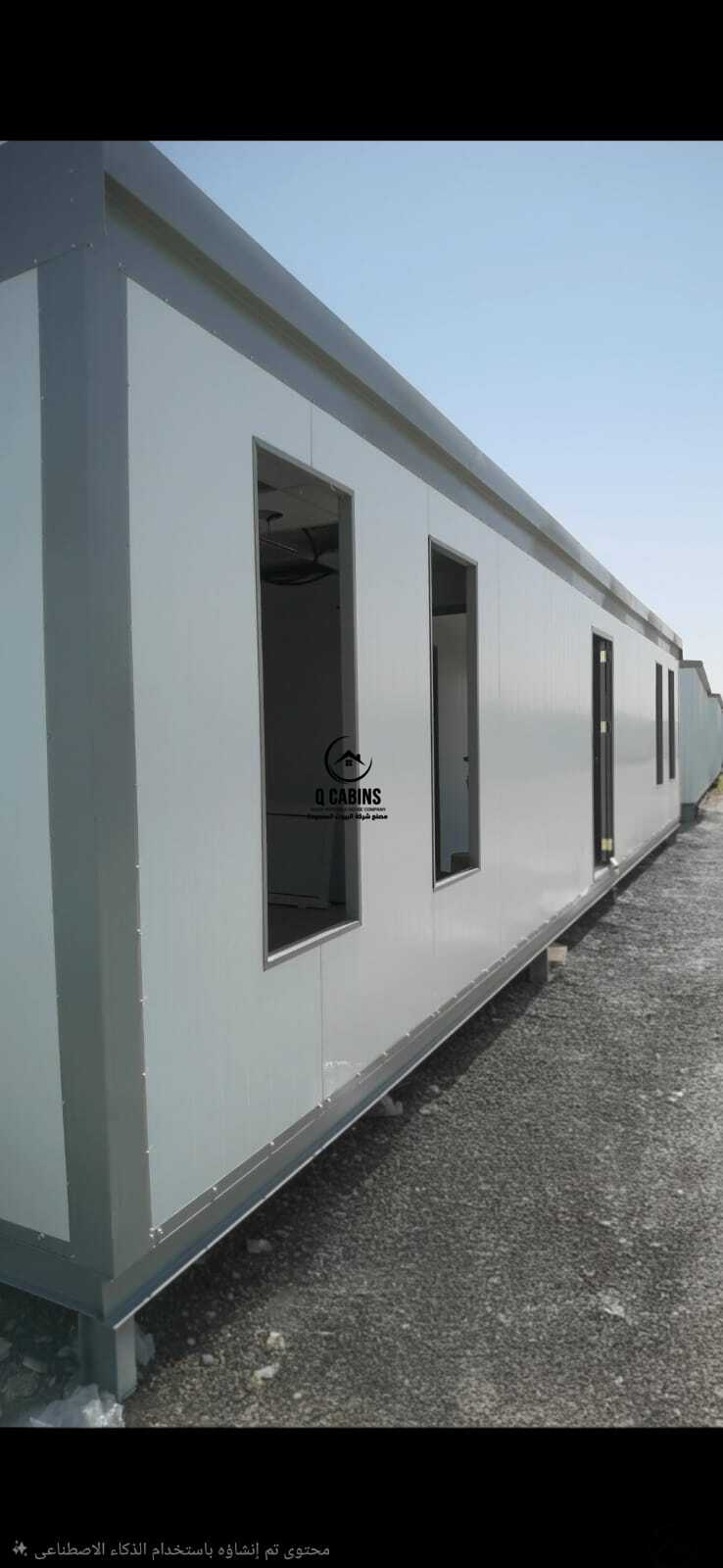 Side elevation of long insulated sandwich panel building with high vertical windows
