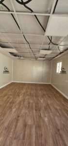 Spacious interior of a modern sandwich panel prefabricated office